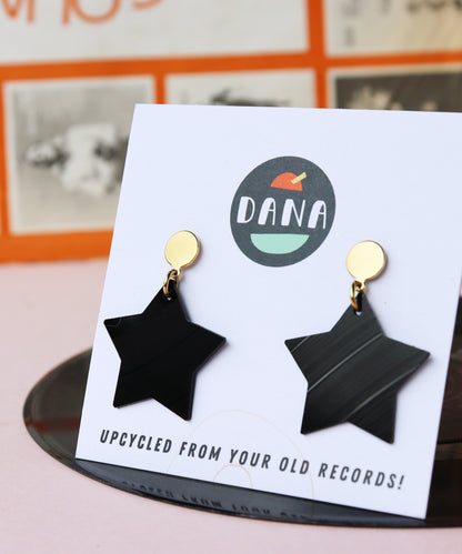 Black star earrings with gold posts handmade in Ireland from recycled vinyl record. 