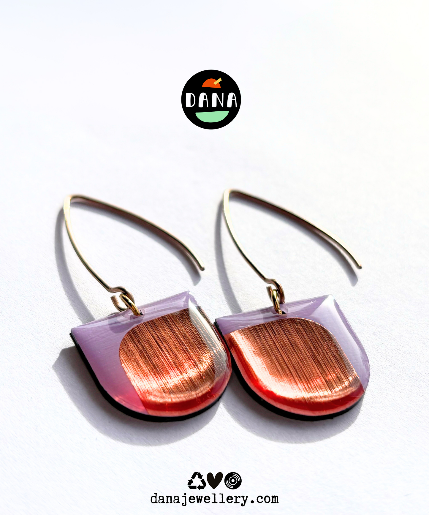 Pair of eco friendly minimalist modern lilac and metallic copper detail earrings handmade in Ireland from recycled vinyl record. 